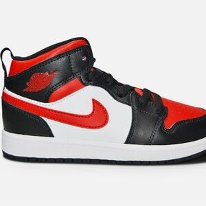 KIDS BLACK AND RED RETRO JORDAN 1  MID SIZE 10C. USED IN GOOD CONDITION.
